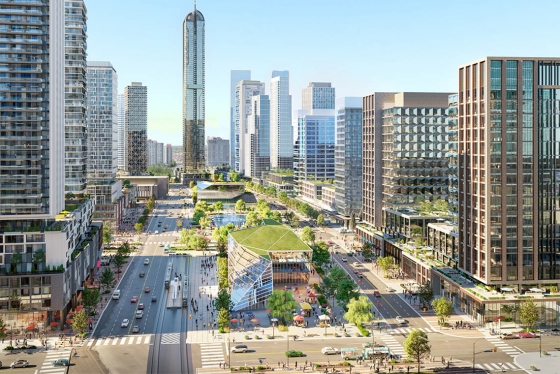 An architectural rendering shows green-roofed glass buildings and a pond between busy roads and skyscrapers.