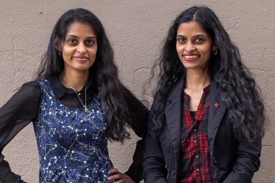 Sandhya and Swapna Mylabathula smile as they stand together.