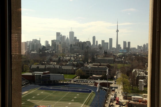The view from a window in the OISE building looks over Varsity Stadium and downtown Toronto.