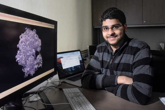 Ali Punjani looks up from his computer screen, which displays an image of an intricate irregular mass.