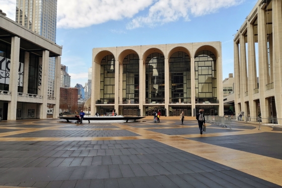 The Metropolitan Opera house in New York City has a front with five narrow, tall, rounded arches.
