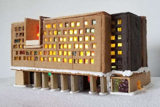 New College built from gingerbread features glowing sugar windows, wafer pillars, and snow icing.