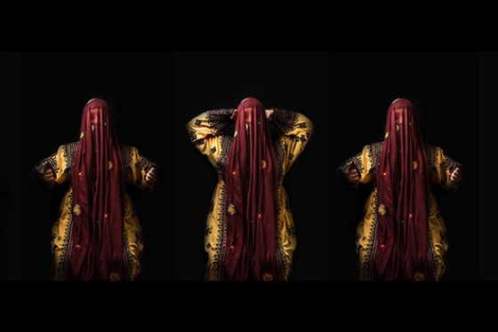 Seven photos stitched together: a woman in a gold robe and red veil raises her hands from waist to head and back again.