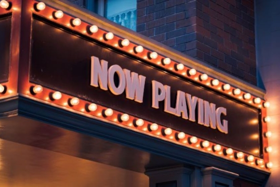 theatre signage that says "now playing"