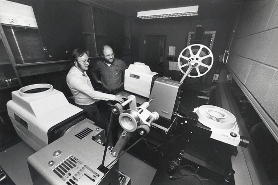 Innis Town Hall projection booth being operated by David Clanfield and Joe Medjuck. 