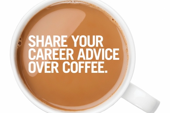 Overhead view of a full, white mug of coffee with "share your career advice over coffees" written on it.