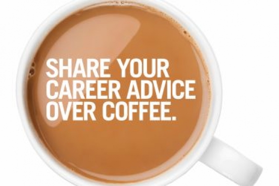 Top view of a cup of coffee with white writing - Share you career advice over coffee