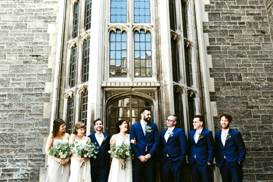 A beaming bridal party in front of U of T