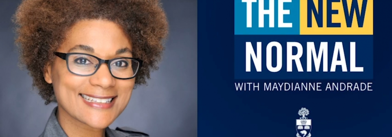 Maydianne Andrade smiles next to a screen showing the name of her podcast: The New Normal.