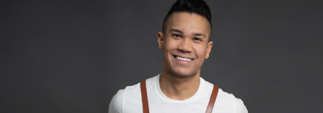 Portrait of Colin Asuncion smiling.
