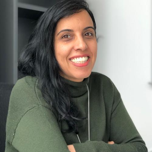 Professor Negin Dahya smiles warmly