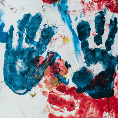 Hand prints in several colours of paint