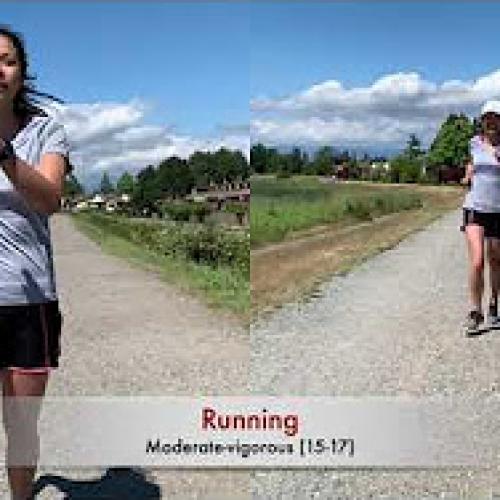 Woman in t-shirts and shorts running along a road