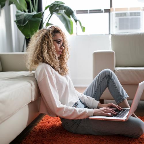 Woman at home on laptop