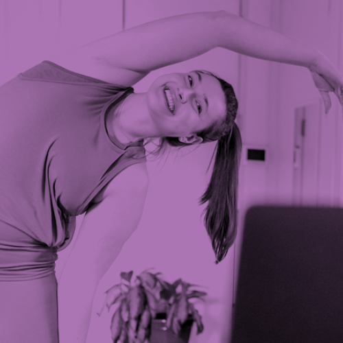 Woman doing exercises at home in front of computer.