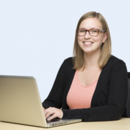 Alum sitting at laptop