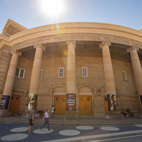 Front view of Convocation hall on sunny day.