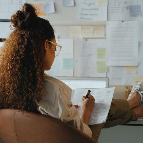 Woman studying on her computer.