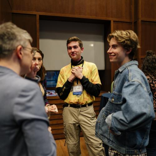 Alumni talking together in a networking event.