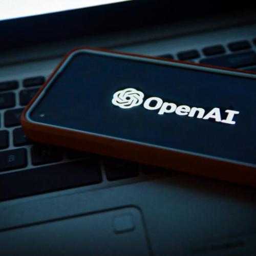 OpenAI logo near laptop computer