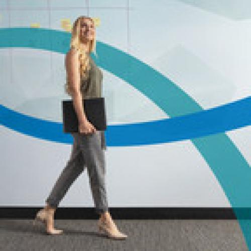 Woman walks to the side indoors