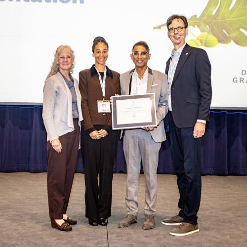 Photo of Dr.Vivian with Carl Mitchell award.