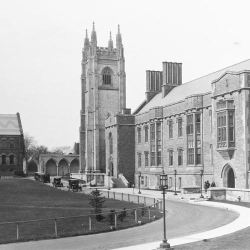 An archival photo of Hart House in 1925 shows no ivy, a treeless lawn, and Model-T Ford cars in the driveway.