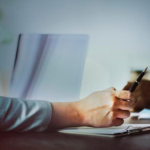 Photo of hand tapping pen on desk by rawpixel.com on Unsplash