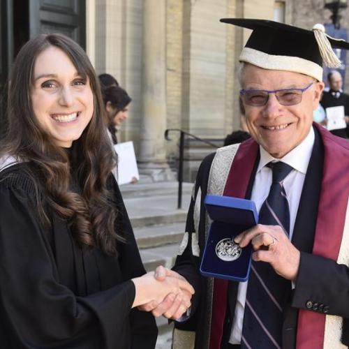 Olivia Rennie is congratulated by U of T Scarborough Principal Bruce Kidd