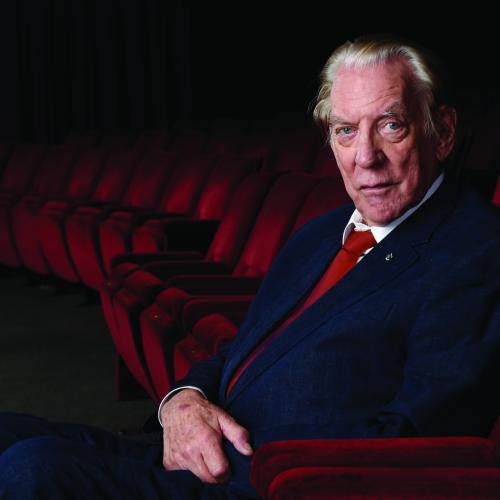 A man sitting in a cinema seat