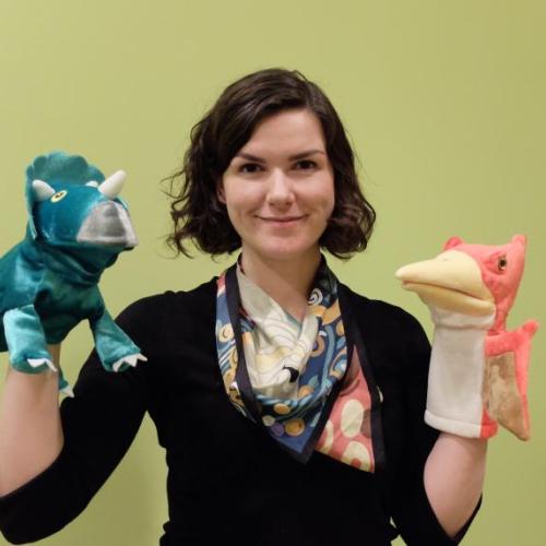 Linguist Ailís Cournane, who specialized in children's language acquisition, holds props from the Child Language Lab that she leads at New York University (photo by Sheng-Fu Wang) 