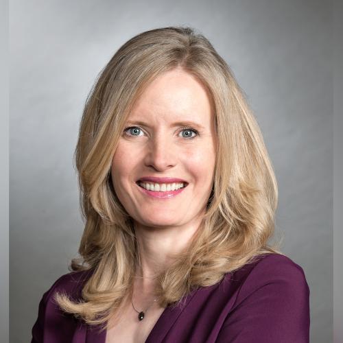Portrait photo of Claire Kennedy smiling.