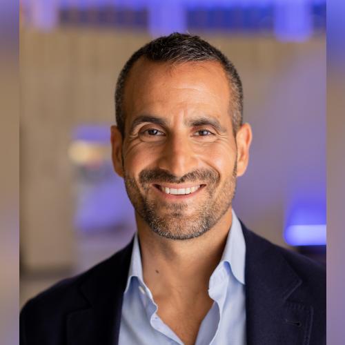 Portrait photo of Som Seif smiling.