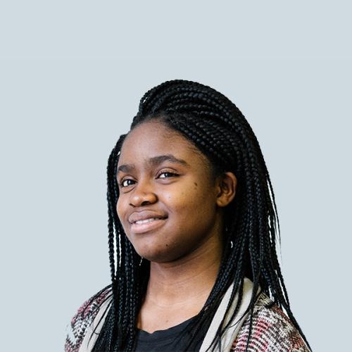 Portrait of Inioluwa Deborah Raji smiling.