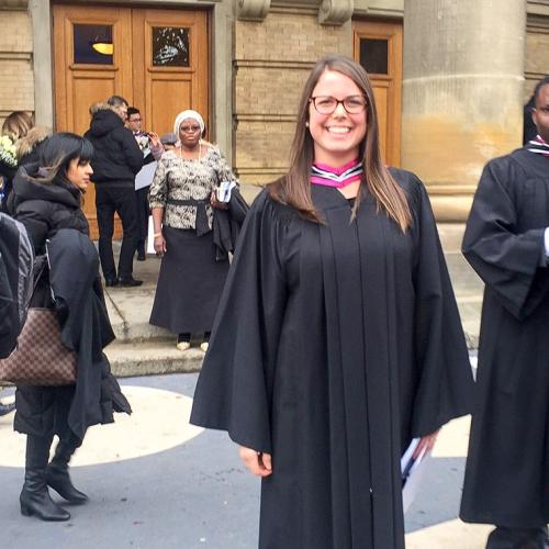 Erica Gavel smiles broadly as she stands among the swirling crowd on the steps of Convocation Hall.