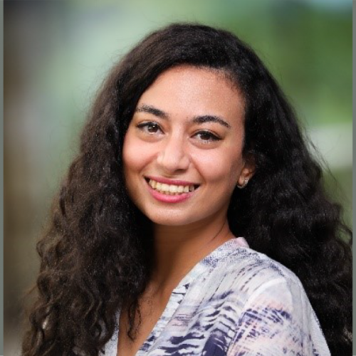 Portrait image of Gina El Kattan smiling.