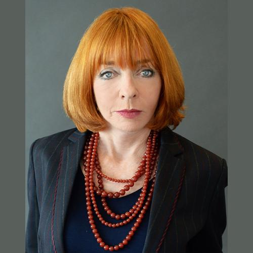 Portrait of Gloria Epstein looking serious.