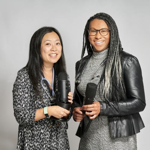 Two women holding microphones 