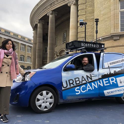 A car parked outside Convocation Hall has the words #UrbanScanner on its side and a tray of equipment on its roofrack.