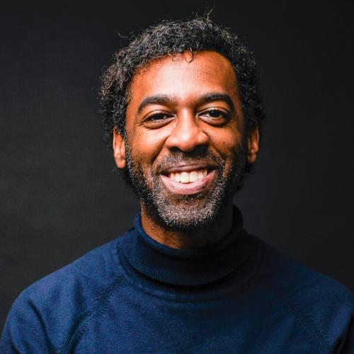 Photo of Ian Williams smiling happily.