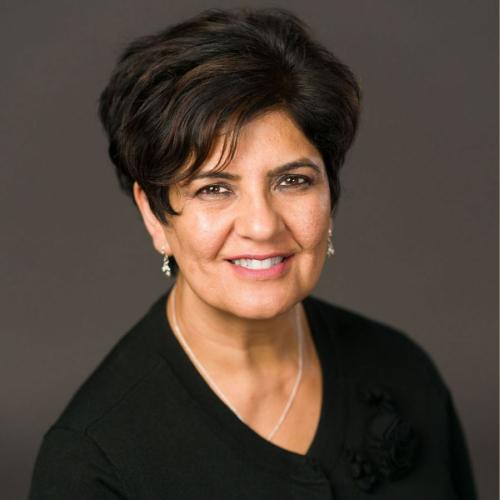 Formal portrait of Karima Velji smiling.