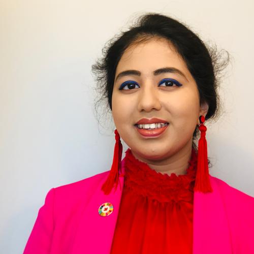 Portrait photo of Kehkashan Basu smiling.