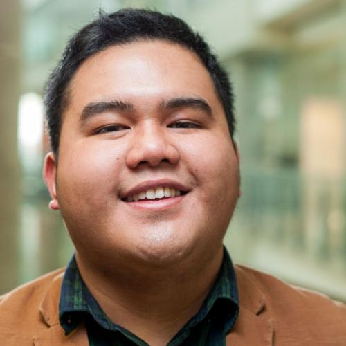 A portrait of LJ smiling