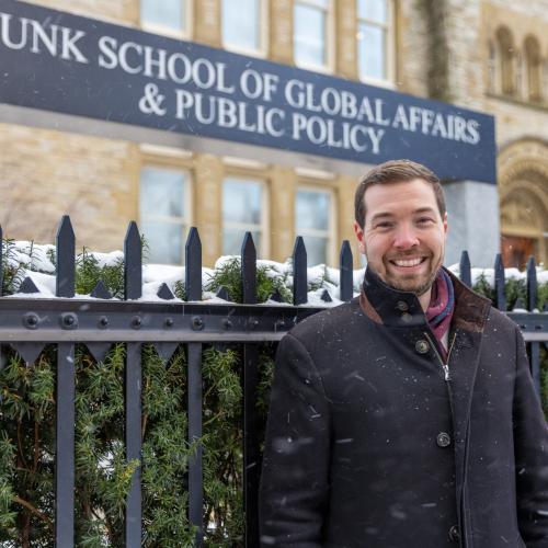 David Kepes standing in front of U of T's Munk School