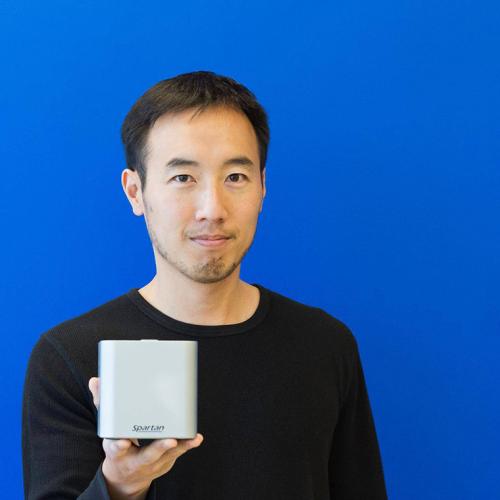 Paul Lem holds out his test kit, a small silver box.
