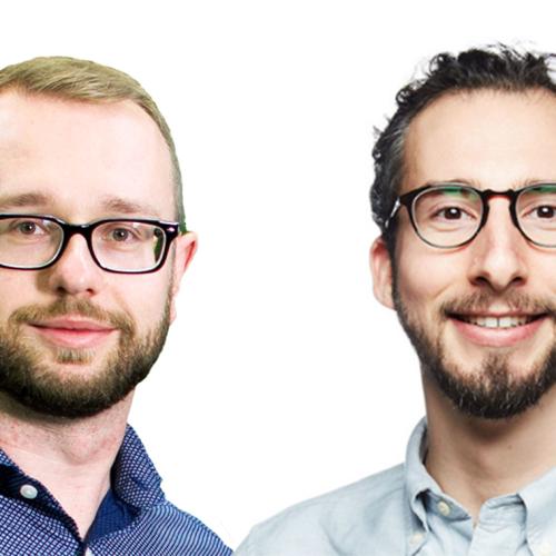 Pawel Buczkowicz and Orion Buske stand side by side and smile.