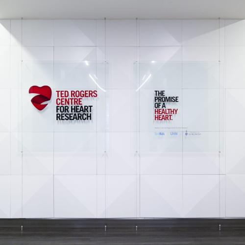 Signs on a wall: Ted Rogers Centre for Heart Research, the promise of a healthy heart.