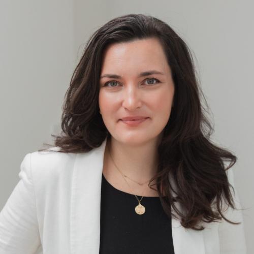 Portrait of Tieghan wearing a white blazer and black shirt