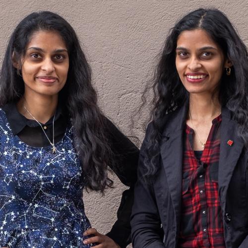 Sandhya and Swapna Mylabathula smile as they stand together.