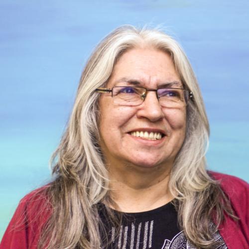 Portrait of Lee Maracle smiling.